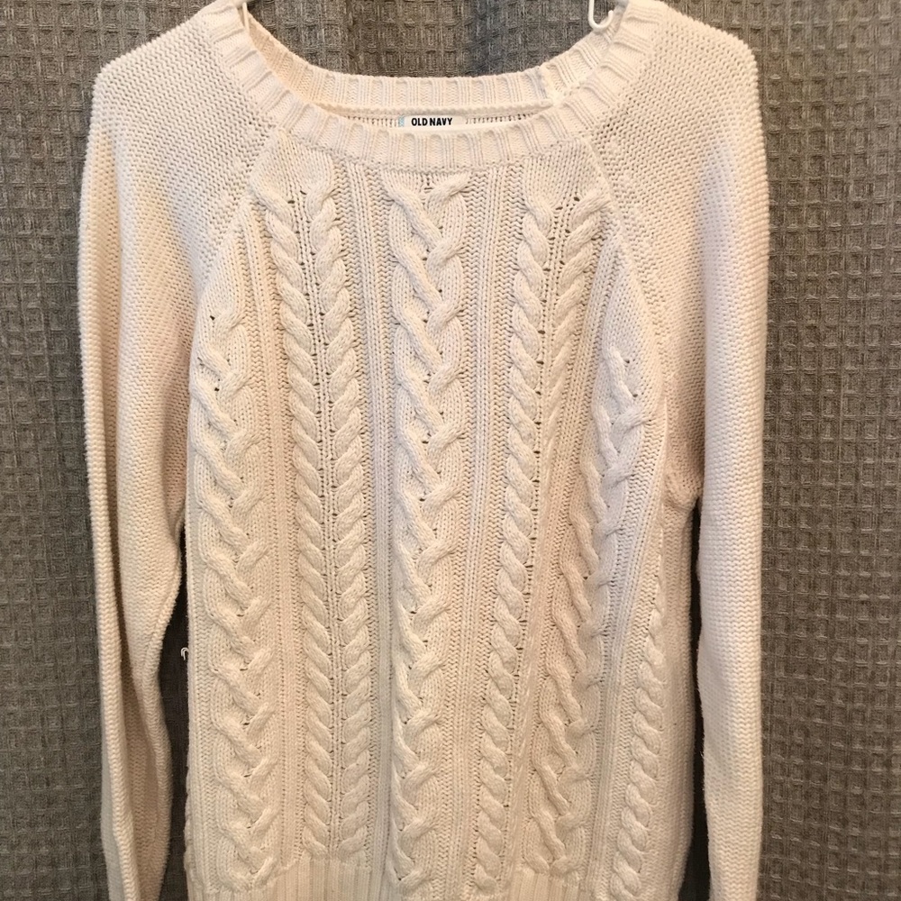 Tan sweater with braided thread design